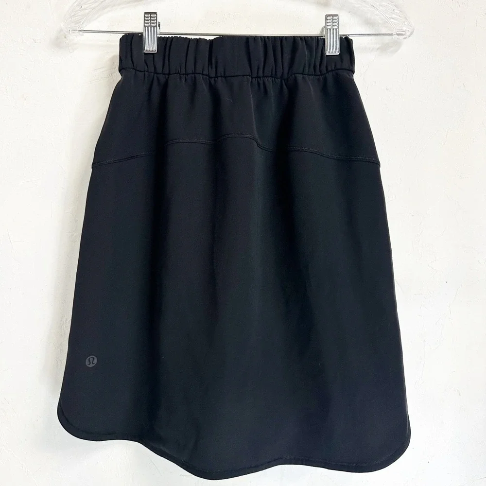 Lululemon Athletic On The Fly Skirt Black Drawstring Pockets Women's 2 Tennis